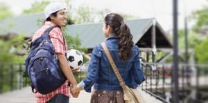 College couple holding hands