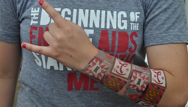 Young woman wearing T-shirt calling for the end of AIDS