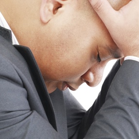 Depressed African American businessman