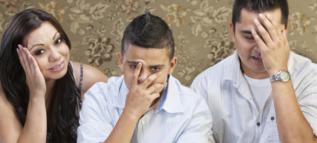 Frustrated Latino parents with teenage son