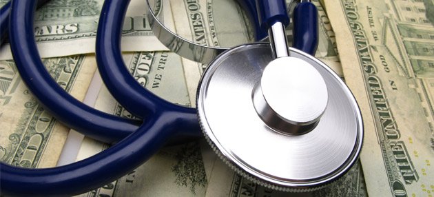 Stethoscope on pile of money