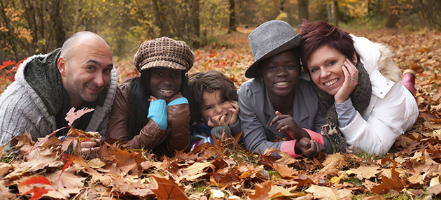 Adopted, multi-race family enjoying an autumn day