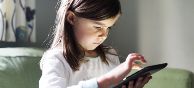 Little girl using tablet
