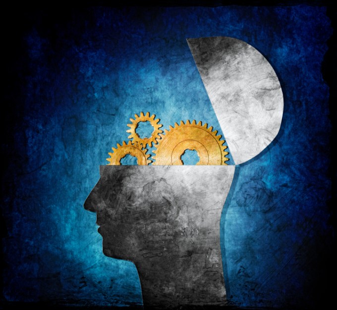 Raster collage illustration of an opened head with cog gears