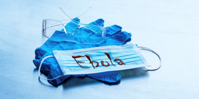 Latex gloves and medical mask with Ebola sign