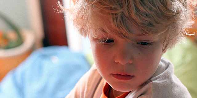Young boy with sad expression